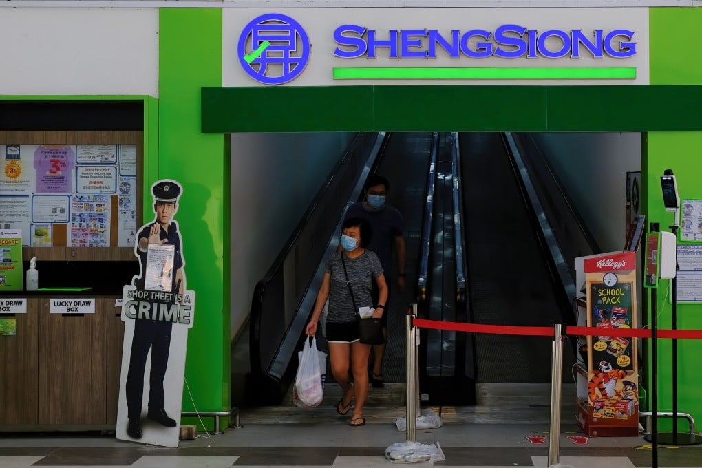 Shoppers leave a Sheng Siong supermarket at Canberra estate in Singapore. Most of the company’s 64 stores are found in public housing blocks with a high concentration of flats. Photo: Shutterstock