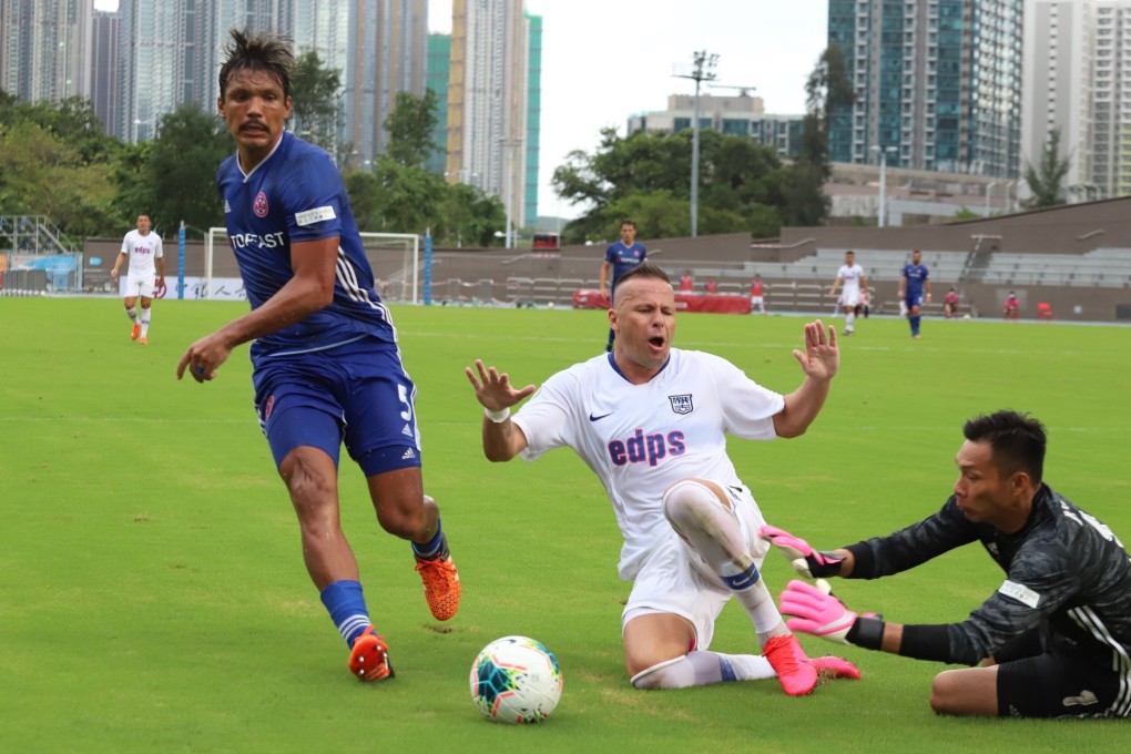 Eastern goalkeeper Yapp Hung-fai stops Kitchee striker Nikola Komazec, with Eastern central defender Clayton Afonso watching on in the Hong Kong Premier League match at Tseung Kwan O Sports Ground. Photo: Chan Kin-wa