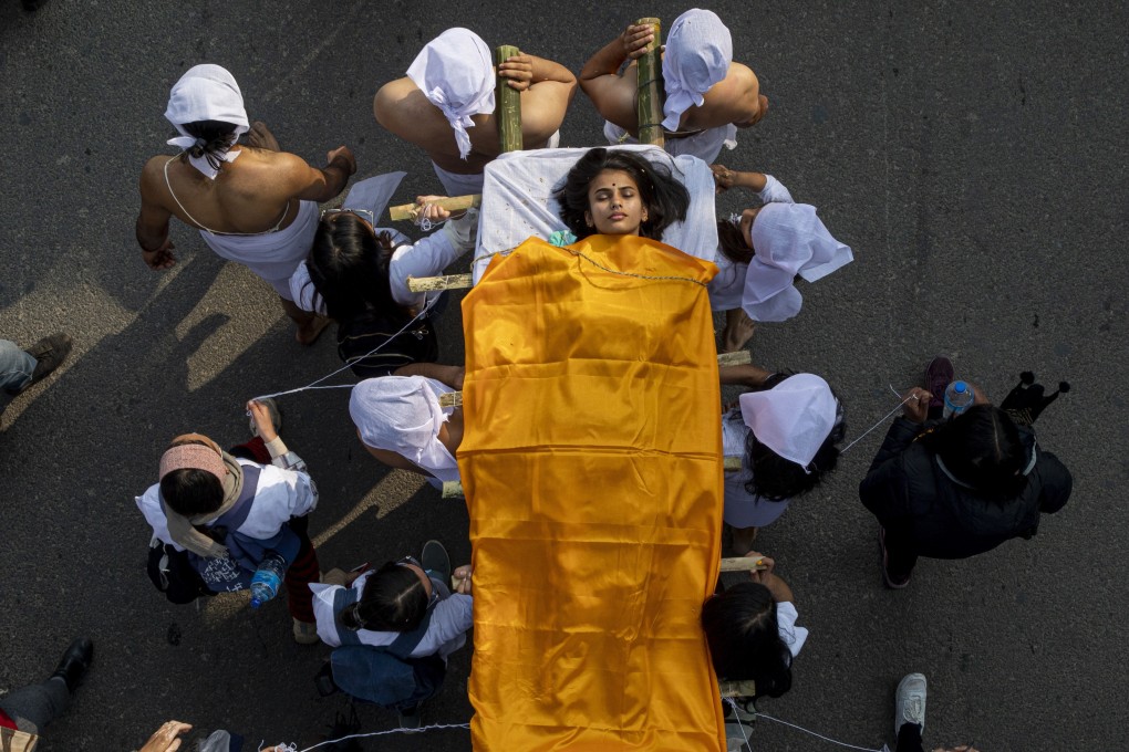 Activists stage a mock funeral during a protest against rape in Kathmandu on Friday. Photo: EPA-EFE