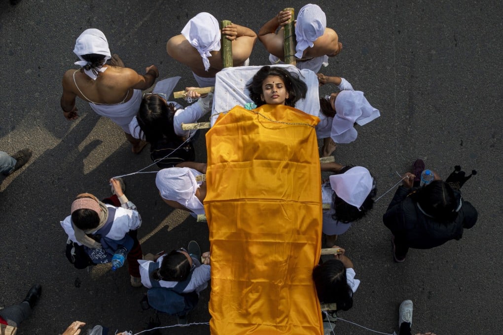 Activists stage a mock funeral during a protest against rape in Kathmandu on Friday. Photo: EPA-EFE