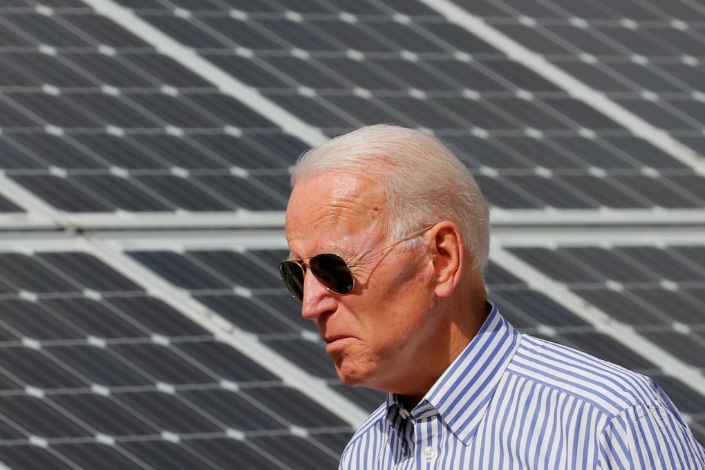 Joe Biden, then US presidential candidate, walks past solar panels while touring the Plymouth Area Renewable Energy Initiative in Plymouth, New Hampshire, on June 4, 2019. Photo: Reuters