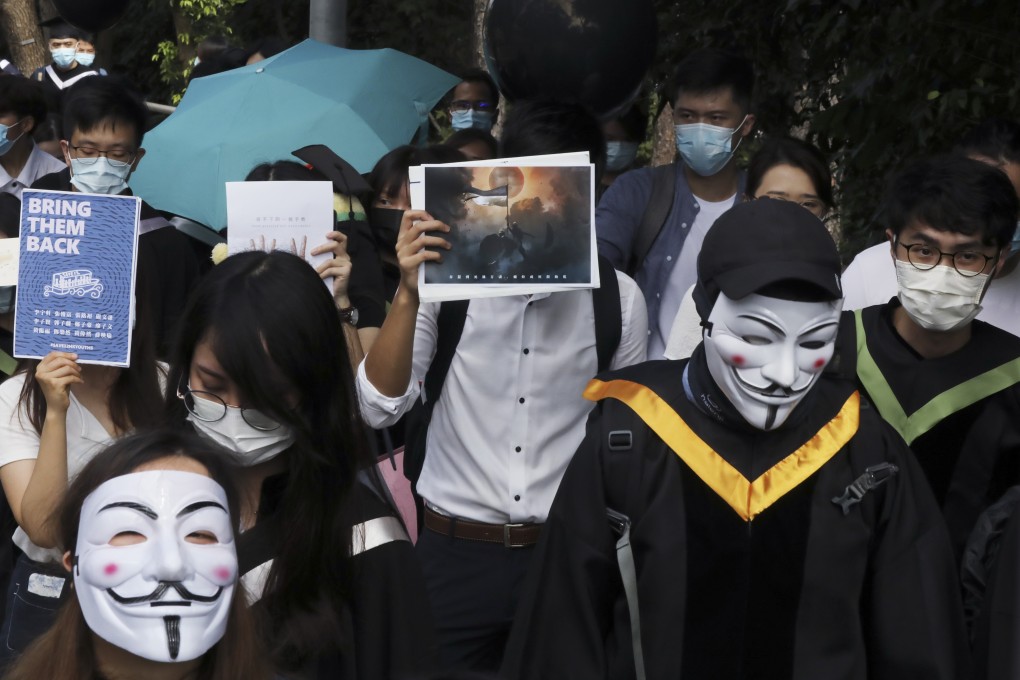 Graduates of the Chinese University of Hong Kong during a march calling attention to the 12 Hongkongers being detained in the mainland in November 2020. Photo: K. Y. Cheng