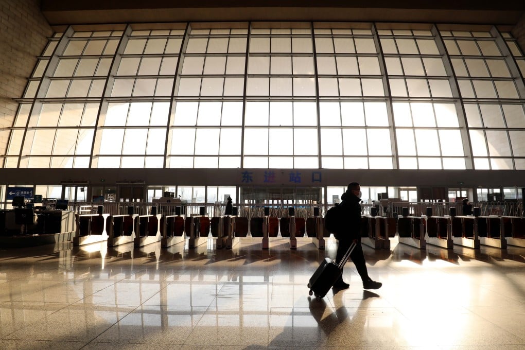 A passenger makes his way through a near-empty railway station in Shijiazhuang, Hebei province last week. The city was at the centre of a coronavirus outbreak in January. Photo: Xinhua