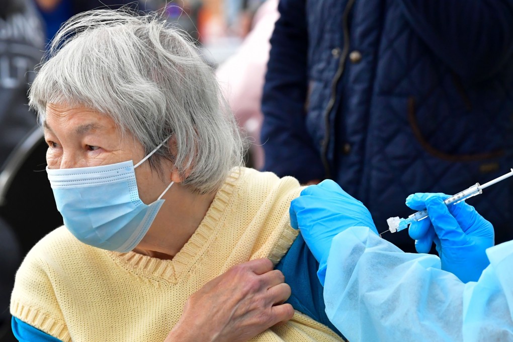 Sofia Russell, 77, receives the Moderna Covid-19 vaccine during a distribution of vaccines to seniors above the age of 65 who are experiencing homelessness at the Los Angeles Mission. Photo: AFP