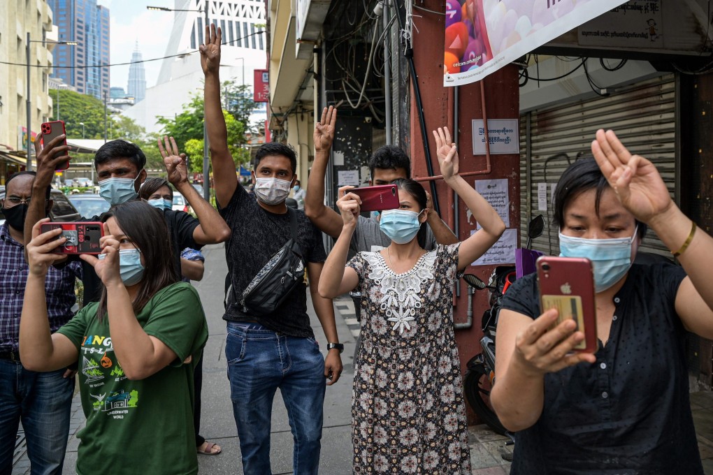 Supporters of Myanmar's National League for Democracy (NLD) give a three-fingered salute during demonstrations against the Myanmar military coup in Kuala Lumpur, Malaysia. Photo: AFP