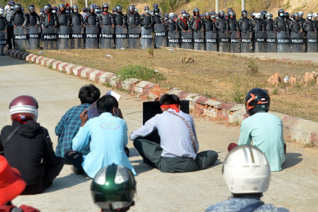 Riot police stand guard near a prison during a demonstration by protesters against the military coup in Naypyidaw on Monday. Photo: AFP