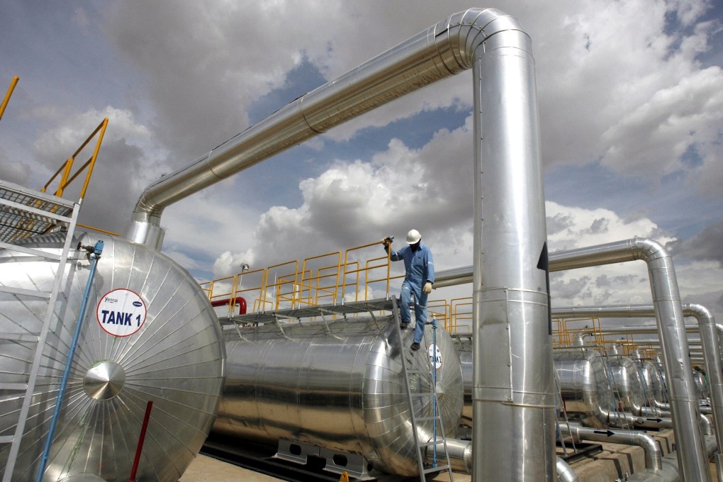 A Cairn India employee works at a storage facility for crude oil at the Mangala oil field in 2009. Photo: Reuters