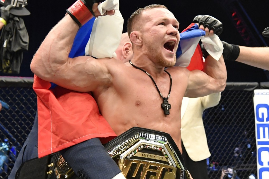 Petr Yan celebrates after his TKO victory over Jose Aldo to win the vacant UFC bantamweight title at UFC 251. Photos: Jeff Bottari/Zuffa LLC via USA TODAY Sports