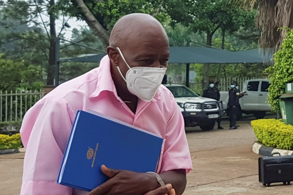 Paul Rusesabagina walks in handcuffs to a courtroom in Kigali on February 17, 2021. Photo: Reuters