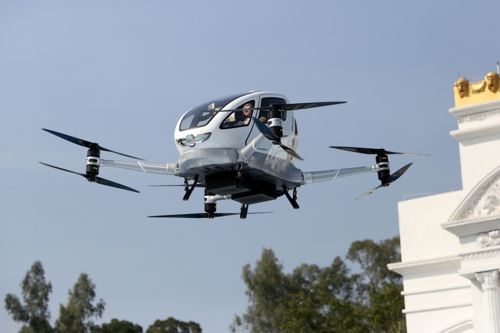 A passenger sits inside an autonomous aerial vehicle made by EHang Holdings during a test flight in Guangzhou, Guangdong province, on February 6, 2018. Photo: Reuters