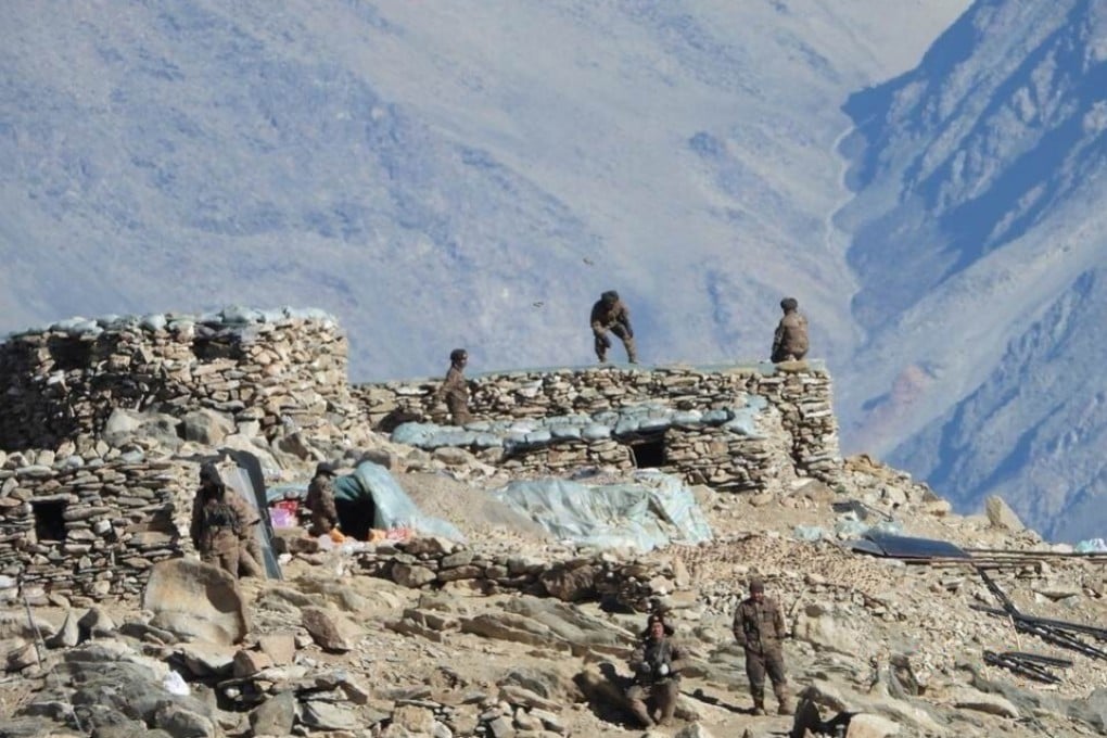 This photograph, provided by the Indian Army, purports to show Chinese troops dismantling their bunkers at Pangong Tso in Ladakh along the India-China border on Monday. China and India are pulling back frontline troops from disputed parts of their mountain border. Photo: Indian Army via AP