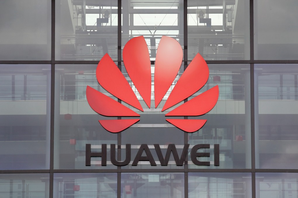 Huawei logo is pictured on the headquarters building in Reading, UK. Photo: Reuters