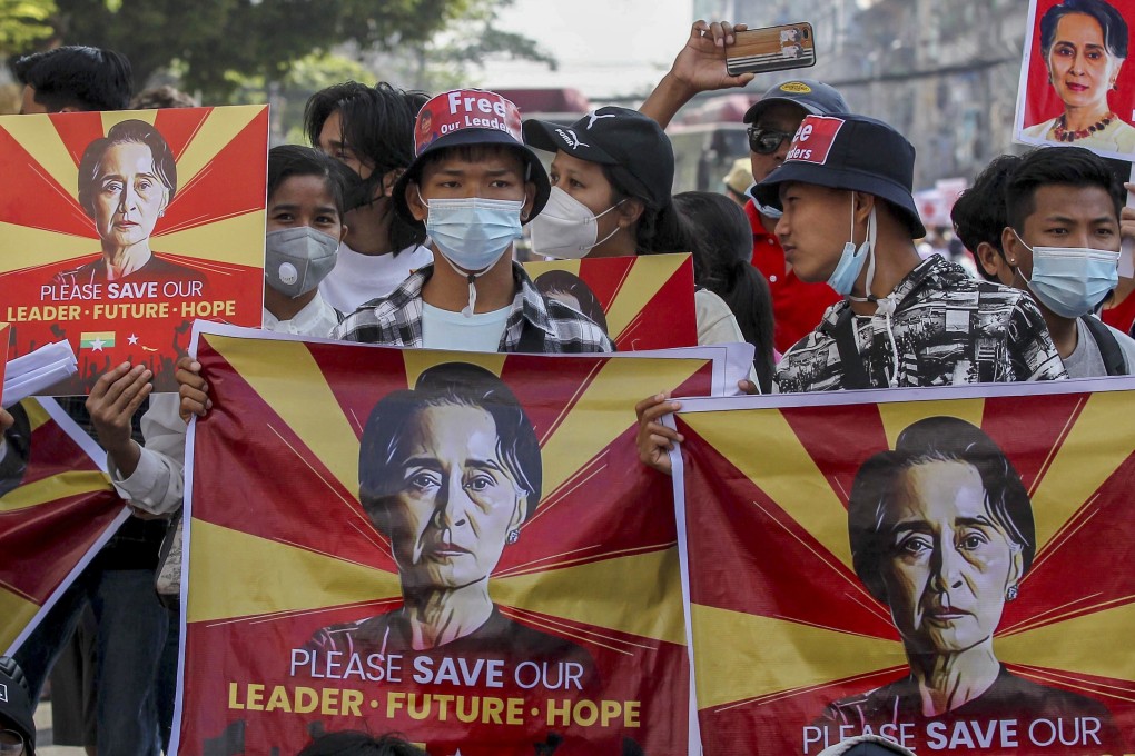 Demonstrators hold placards with pictures of deposed Myanmar leader Aung San Suu Kyi at a protest in Yangon on February 17, 2021. Photo: AP