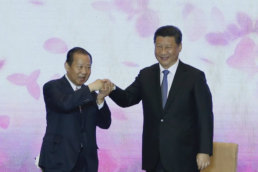 China’s President Xi Jinping holds hands with Toshihiro Nikai from Japan’s Liberal Democratic Party during a 2015 China-Japan friendship exchange meeting in Beijing. Photo: Reuters