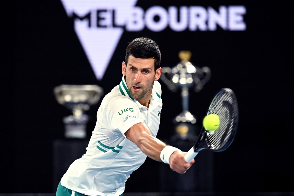 Novak Djokovic reaches to hit a return against Aslan Karatsev in their Australian Open semi-final on Thursday. Photo: Photo: EPA