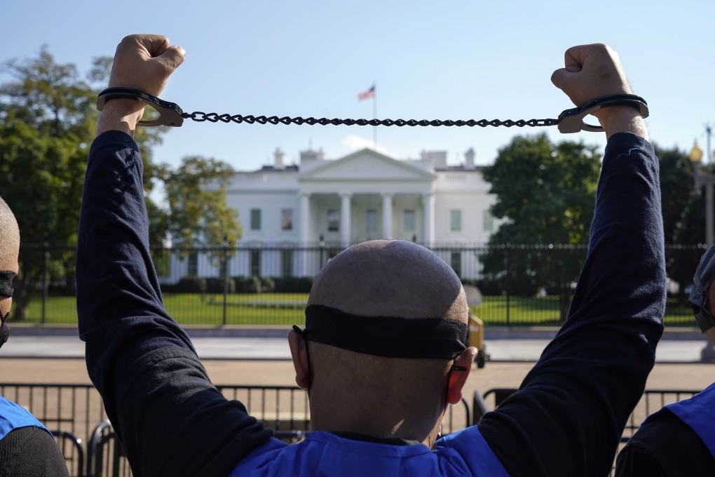 A member of the Uygur American Association demonstrating in October in front of the White House in support of the Uygur Forced Labour Prevention Act, which has been reintroduced in both chambers of the US Congress. Photo: AP