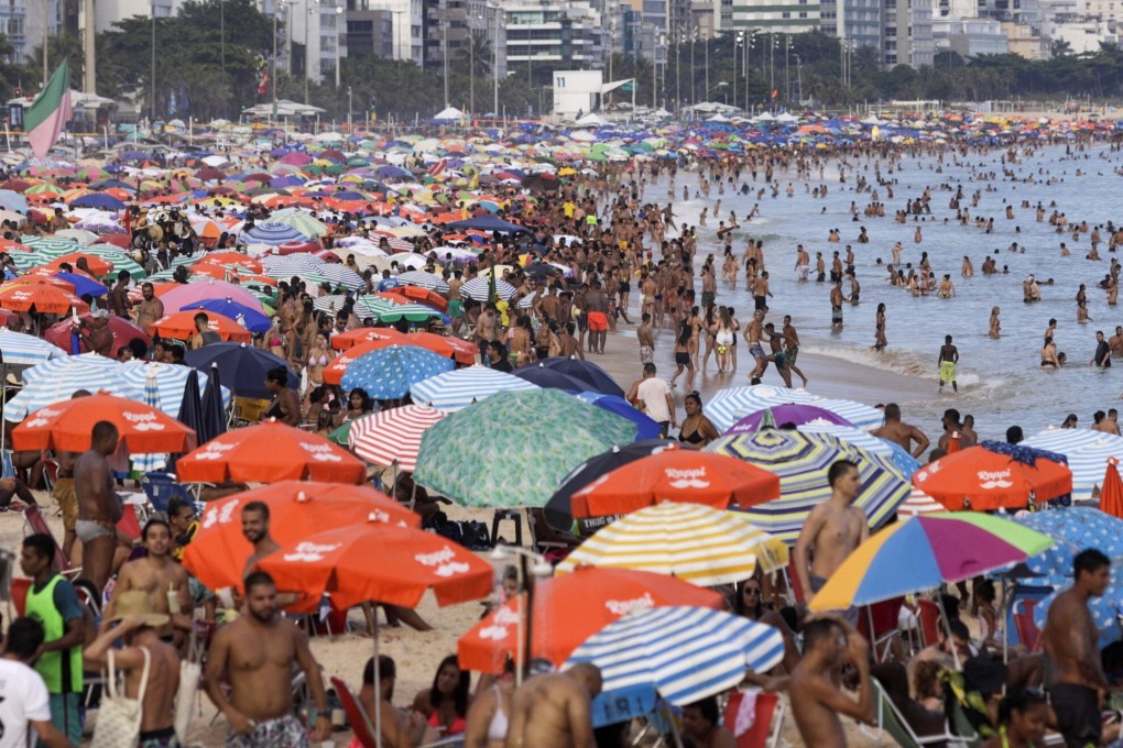Beachgoers enjoy sunny weather in Rio de Janeiro. Brazil is battling a second infection wave. Photo: Reuters