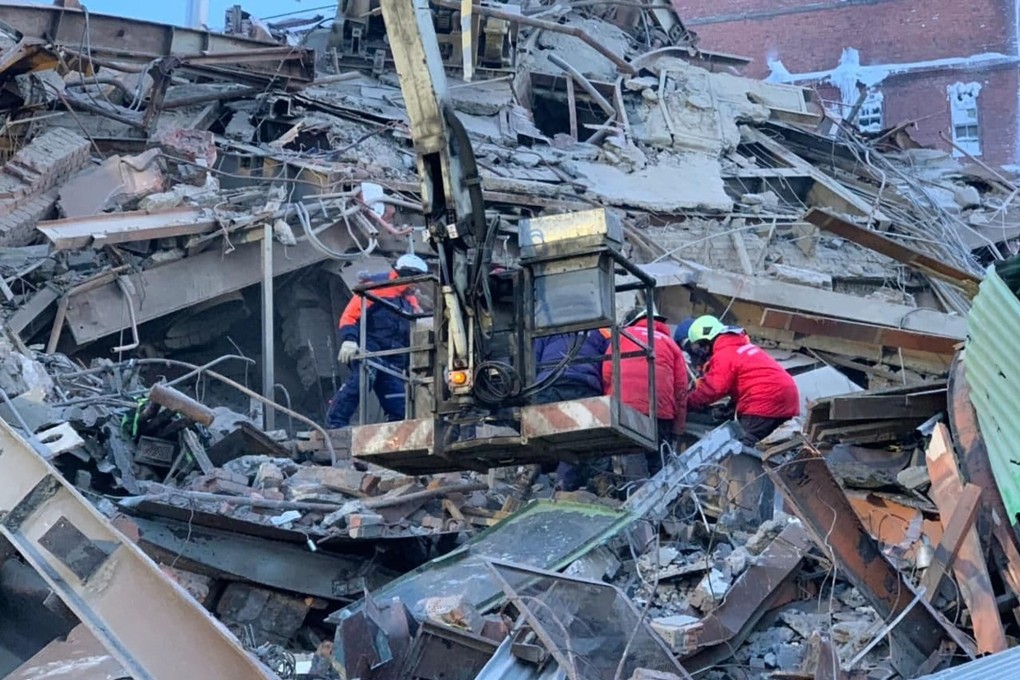 Emergency personnel work at the site of collapsed processing plant in Norilsk in Russia on Saturday. Photo: Ministry of Emergency Situations press service via AP