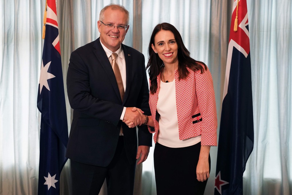 Australian Prime Minister Scott Morrison shakes hands with his New Zealand counterpart Jacinda Ardern in Auckland. File photo: AFP
