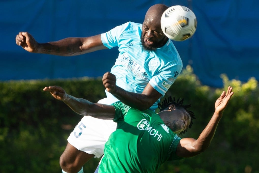 Jean Jacques Kilama of Rangers rises above Happy Valley striker Rasaq Adegbite on the opening day of the 2020-21 Hong Kong Premier League season. Photo: HKFA