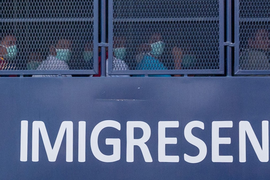 An immigration truck believed to be carrying Myanmar migrants is seen heading towards the naval base in Lumut, Malaysia, on Tuesday. Photo: AFP