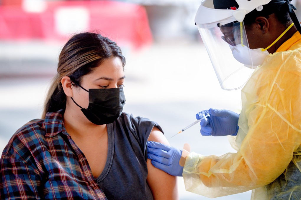 A woman receives a dose of the Pfizer Covid-19 vaccine in California, US. Photo: Orange County Register via ZUMA/DPA