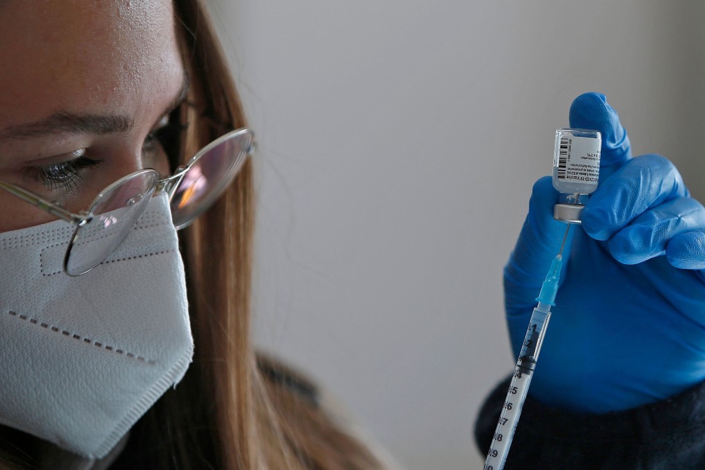 A health worker prepares a dose of the Pfizer-BioNtech Covid-19 coronavirus vaccine at a mobile clinic in Israel. Photo: AFP