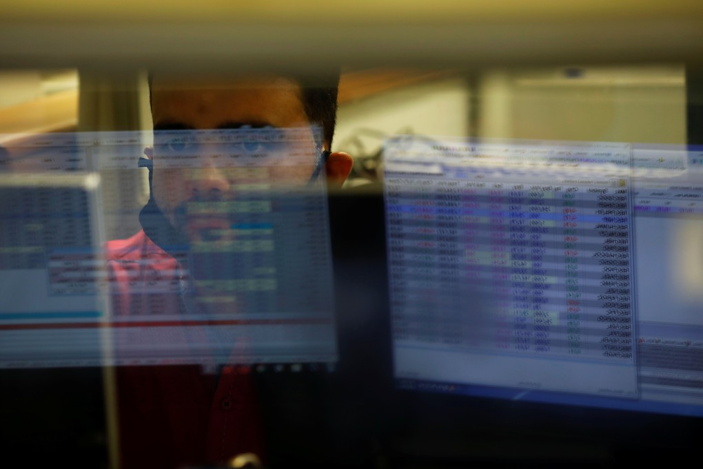 Computer screens showing stocks at a brokerage house. The local market’s swift rally-from-rout this week has created the wildest price swings since August. Photo: AP