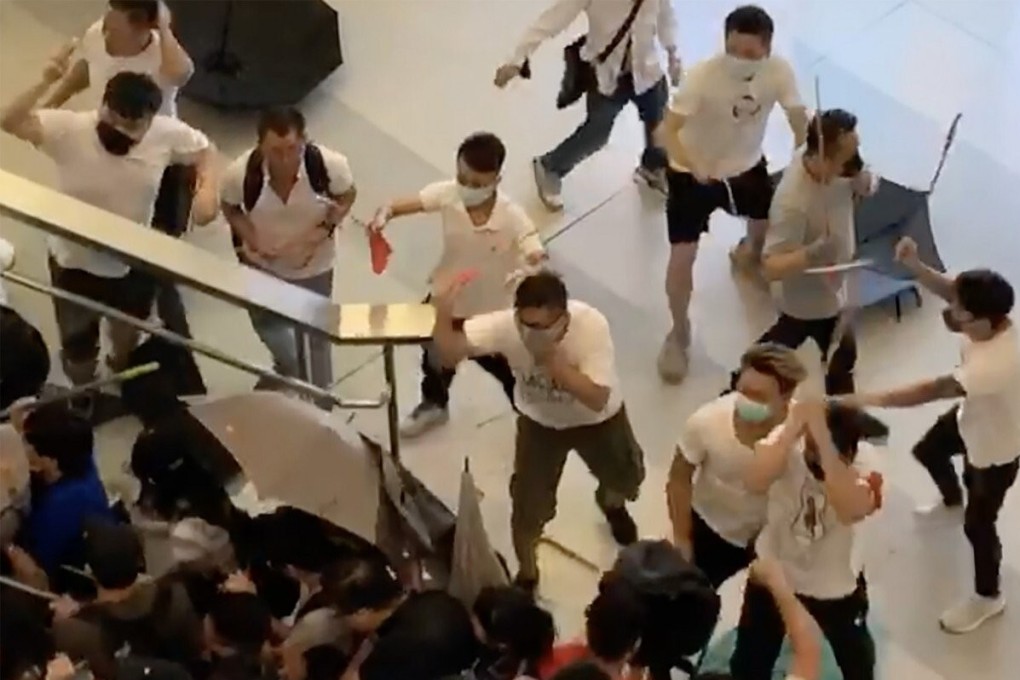 Men clad in white attack carry out the attack at Yuen Long MTR station on July 21, 2019. Photo: SCMP