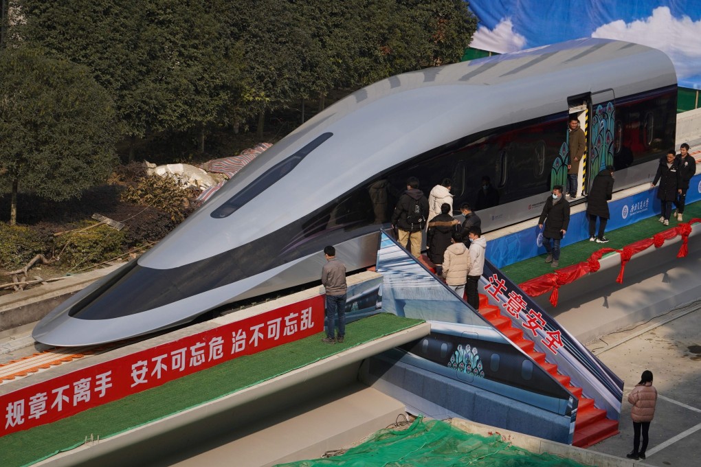 People tour a prototype magnetic levitation train at the launch ceremony in Chengdu, Sichuan province, last month. Such trains could potentially travel at 600km/h (373mph). Photo: AFP