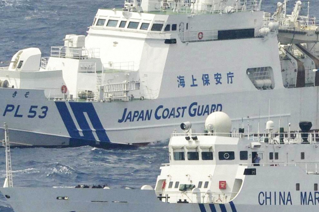 A Chinese marine surveillance vessel and a Japan Coast Guard patrol ship near the Diaoyu Islands in 2012. File photo: Kyodo News via Getty Images