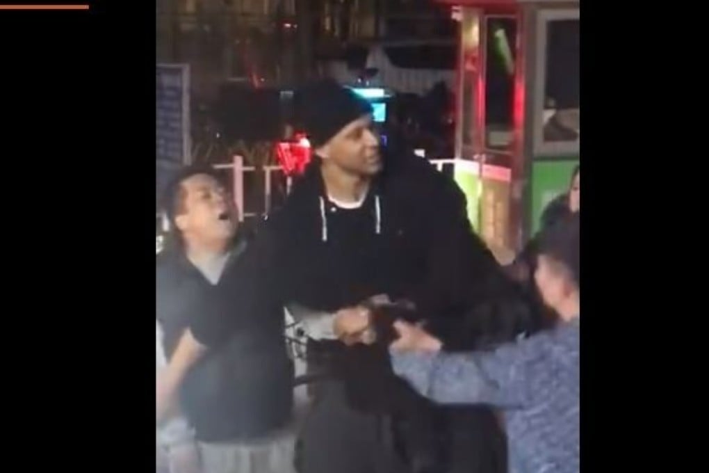 Beijing Ducks centre Randolph Morris acts as peacemaker in a Beijing street fight in 2018. Photo: Weibo