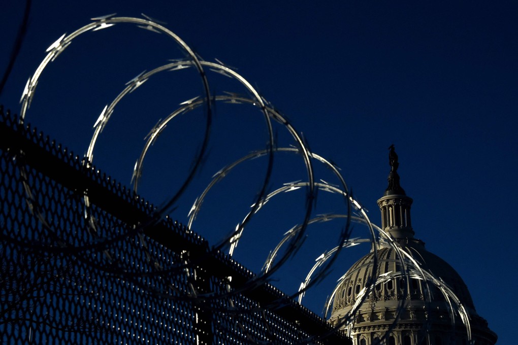 Razor wire tops a security fence outside the US Capitol as part of enhanced security measures after Trump supporters stormed the building in January. Photo: AFP