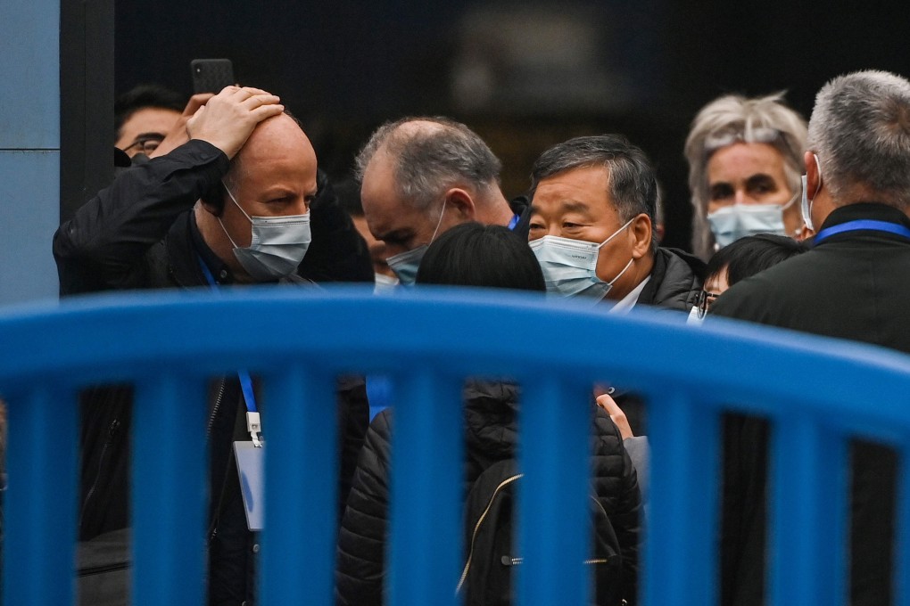 Members of the WHO team investigating the origins of the coronavirus visit the closed Huanan seafood wholesale market in Wuhan on January 31. Photo: AFP