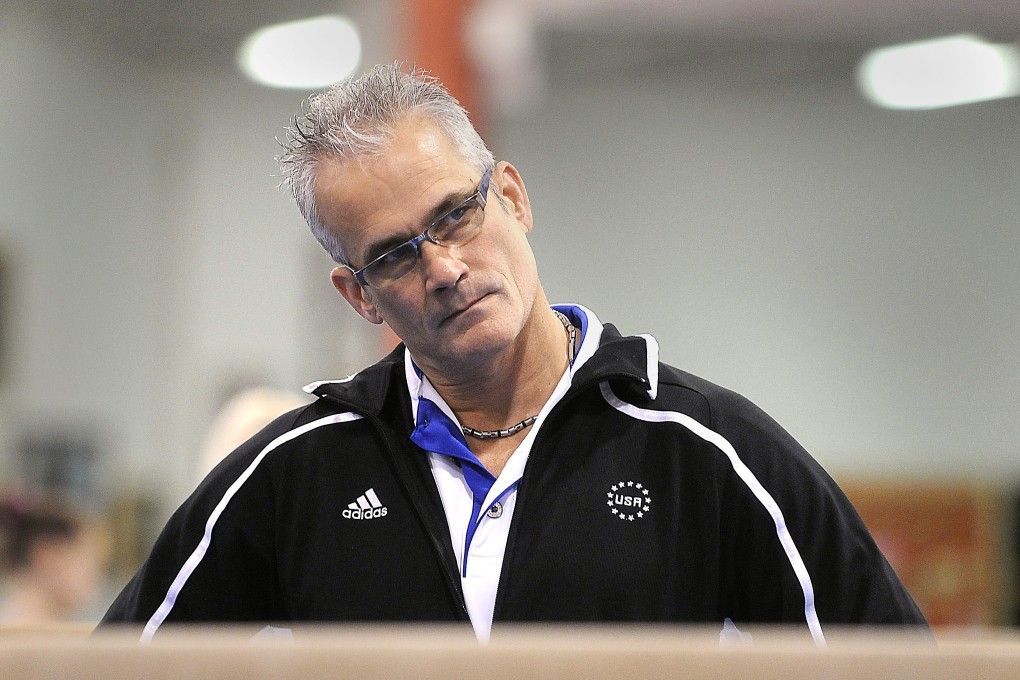 Gymnastics coach John Geddert watches his students during a practice session in Lansing, Michigan, in December 2011. Photo: USA Today Network via Reuters