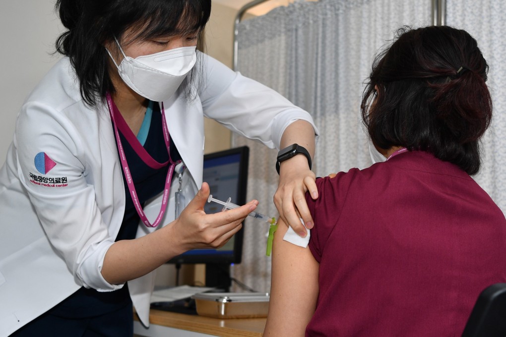 A health worker receives a shot of the Pfizer-BioNTech Covid-19 vaccine at a hospital in Seoul, South Korea, on Saturday. Photo: EPA-EFE