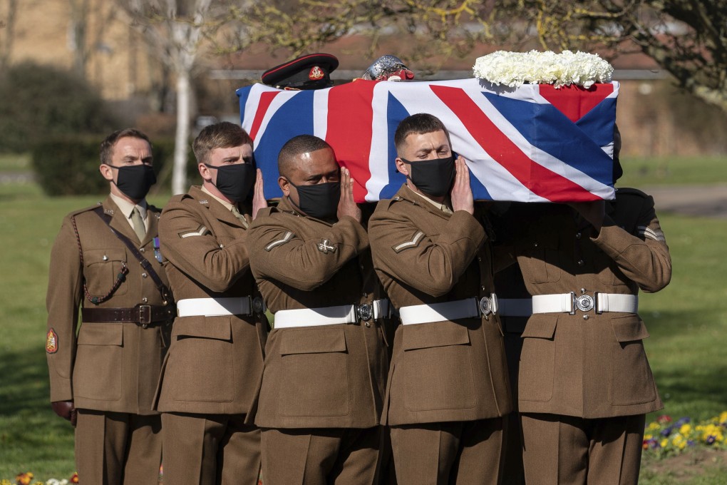 Soldiers from the Yorkshire Regiment carry the coffin of Captain Tom Moore during his funeral in Bedford on Saturday. Photo: AP
