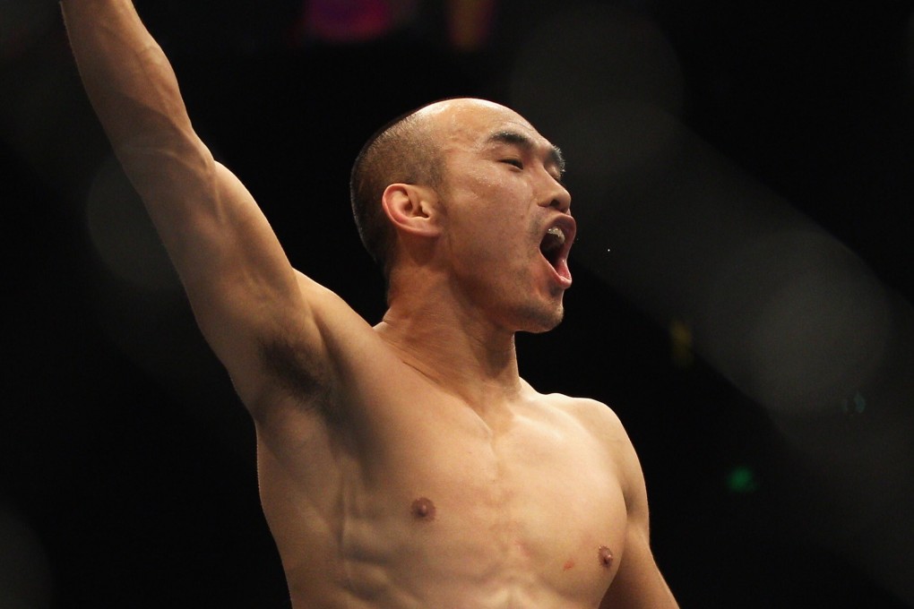 Zhang Tiequan of China celebrates his victory over Jason Reinhardt after their middleweight bout at UFC 127 at Acer Arena on February 27, 2011 in Sydney, Australia. Photo: Mark Kolbe/Getty Images