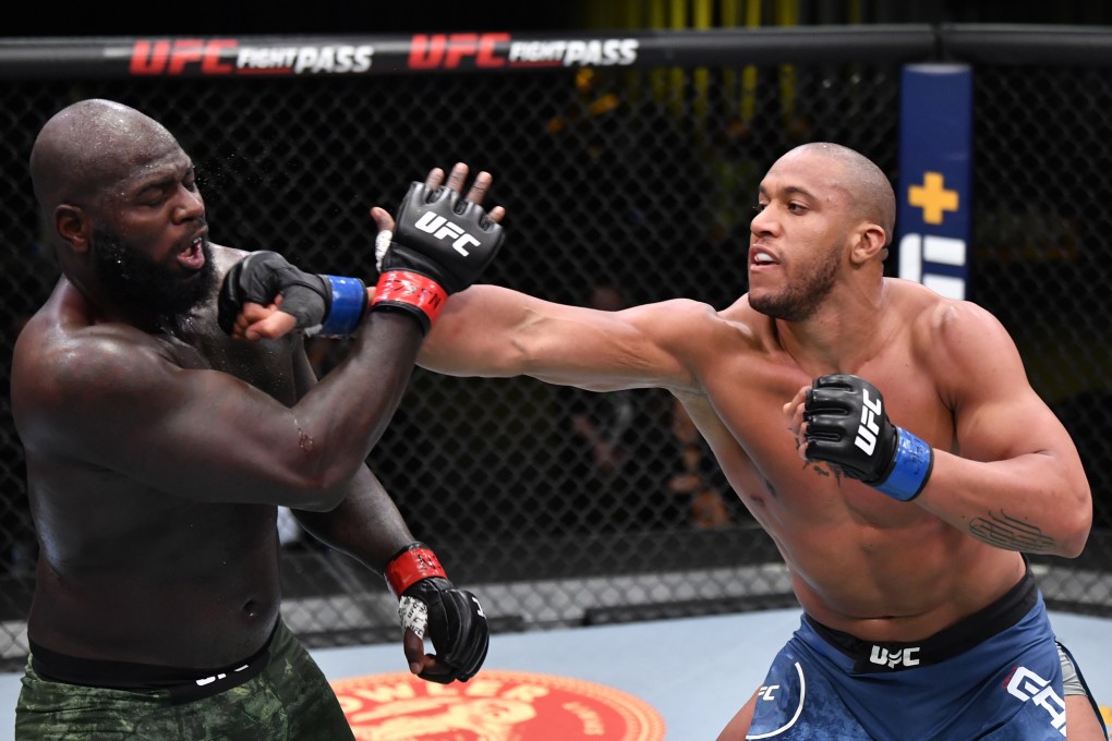 Ciryl Gane jabs Jairzinho Rozenstruik in their heavyweight bout at UFC Fight Night on February 27, 2021 in Las Vegas, Nevada. Photo: Jeff Bottari/Zuffa LLC