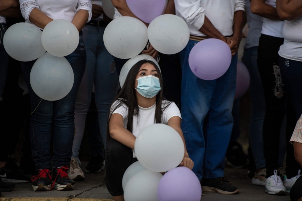 Protesters at a religious event in memories of three young women murdered in the town of Turen in the state of Portuguesa, Venezuela. Photo: AFP