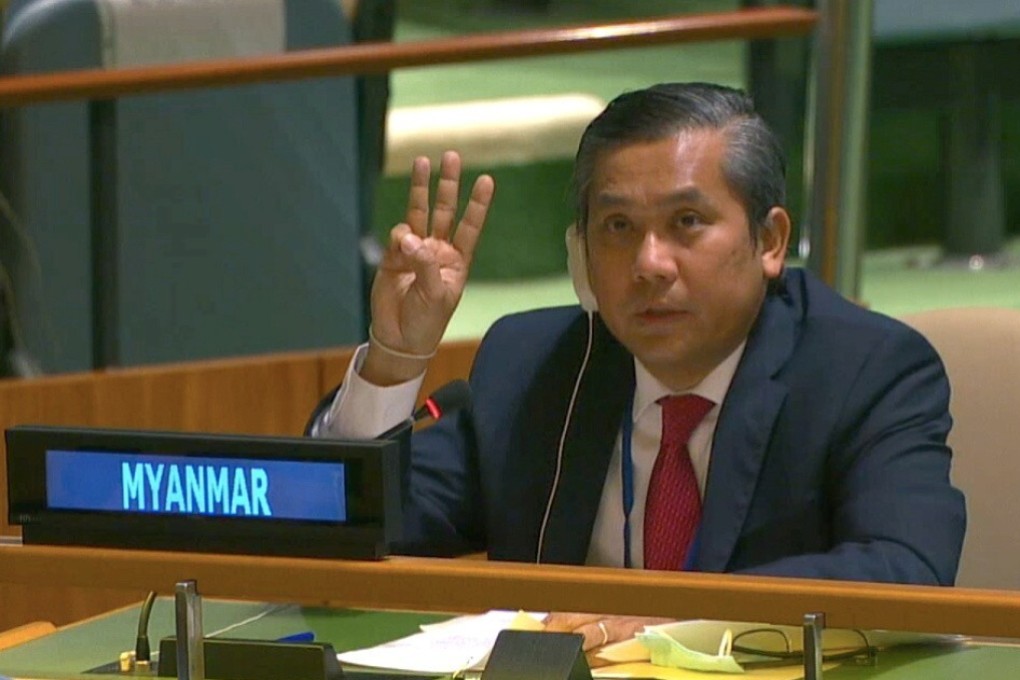 Kyaw Moe Tun, Myanmar‘s ambassador to the United Nations, holds up three fingers at the end of his speech to the General Assembly on Friday. Photo: United Nations TV via Reuters