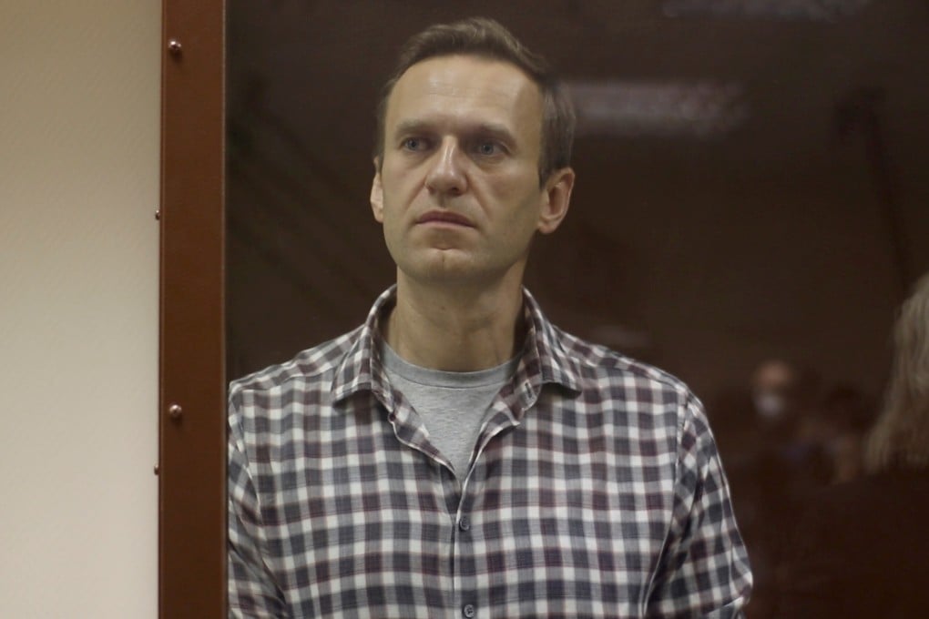 Kremlin critic Alexei Navalny stands inside a defendant dock during a court hearing in Moscow on February 20. Photo: Reuters