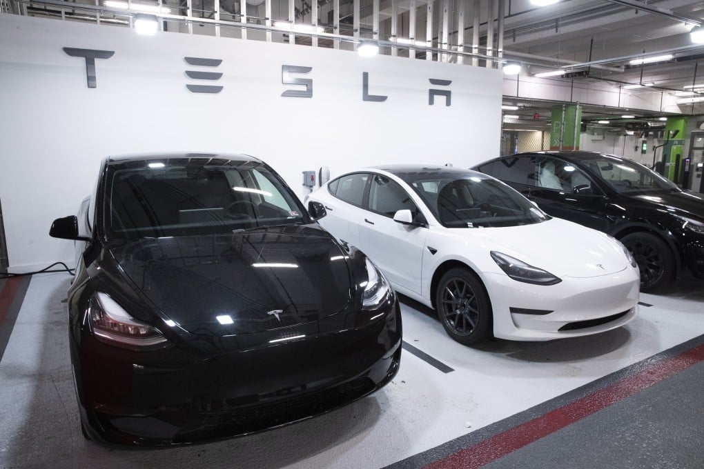 A Tesla Model 3 vehicle, centre, flanked by two Model Y cars. Photo: EPA-EFE