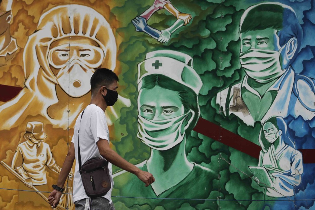 A mural outside the Mission Hospital in Pasig, Philippines, pays tribute to health workers. Photo: AP