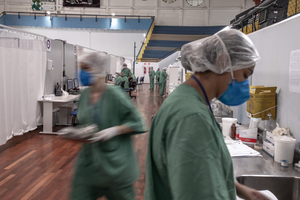 Health care workers treat Covid-19 patients at the Pedro Dell'Antonia sports complex in Santo Andre, Brazil. Photo: Bloomberg