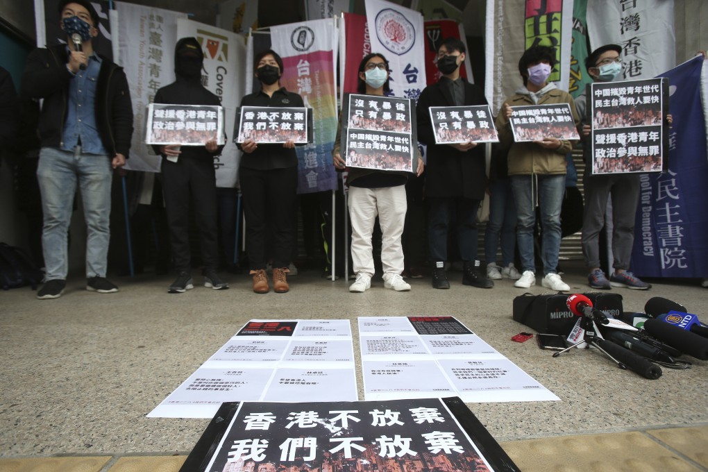 Demonstrators in Taipei show their support for activists facing court in Hong Kong on Tuesday. Photo: AP