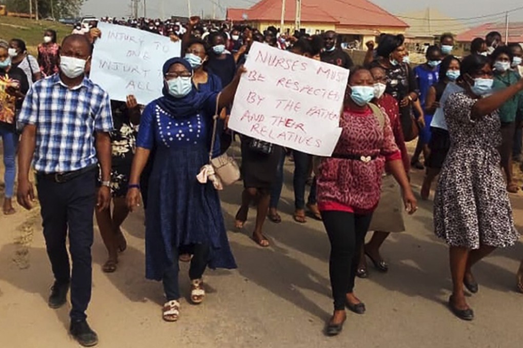 Nurses take part in a march on February 7 to demand that officials provide security for them after two nurses were attacked by the family of a deceased Covid-19 patient. Photo: AP
