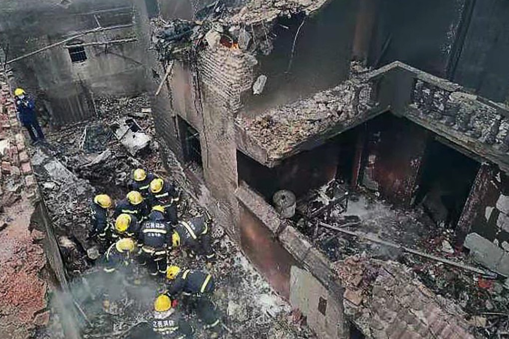 Firefighters deal with the aftermath of the plane crash in Jiangxi province. Photo: CCTV