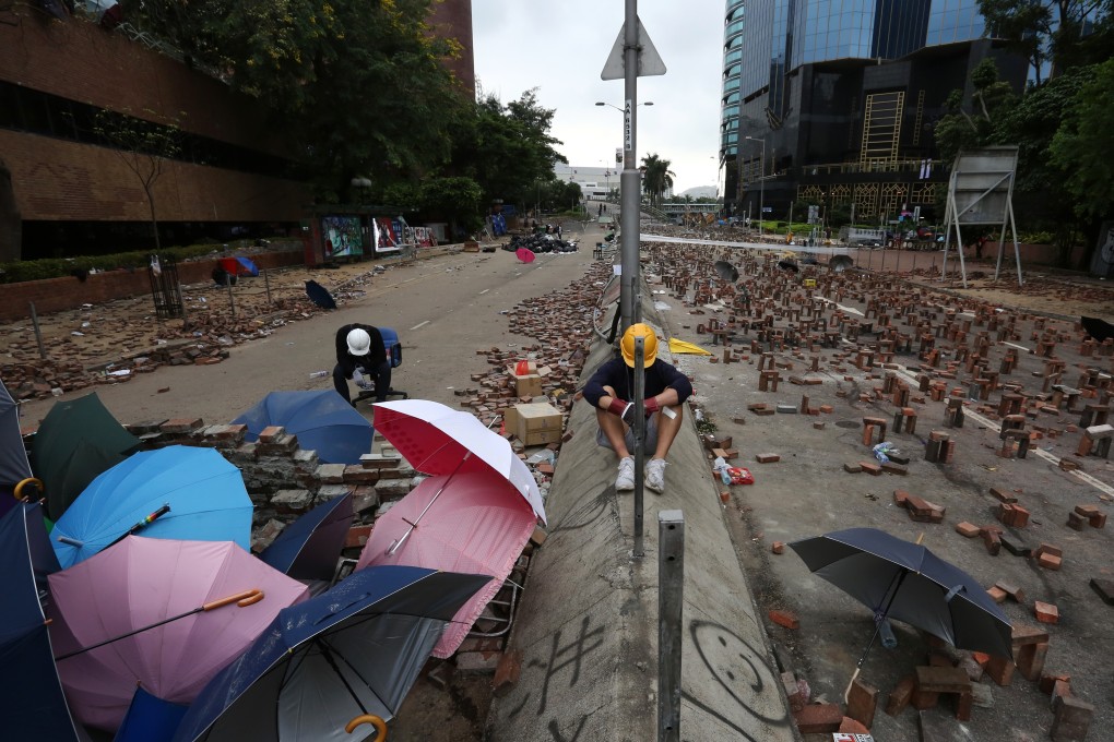 Bricks cover the streets around Polytechnic University, the site of a major clash between police and protesters on November 16, 2019. Photo: Jonathan Wong