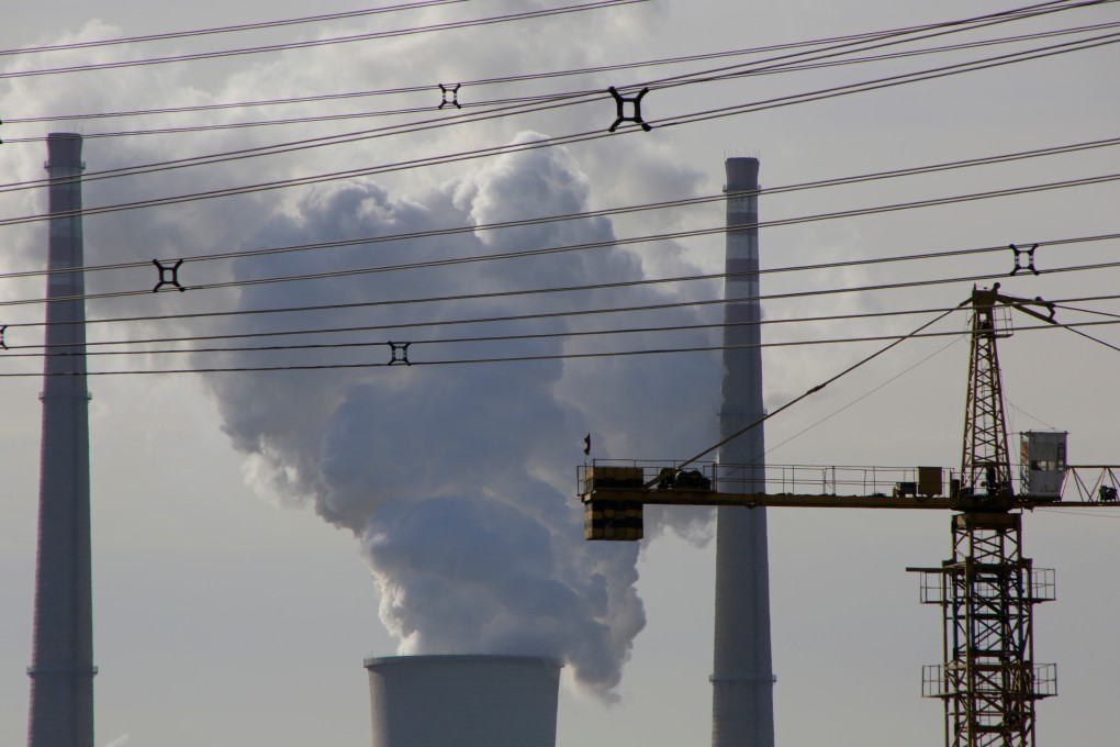 A coal-fired power plant is pictured near a construction site in Beijing. Photo: Reuters
